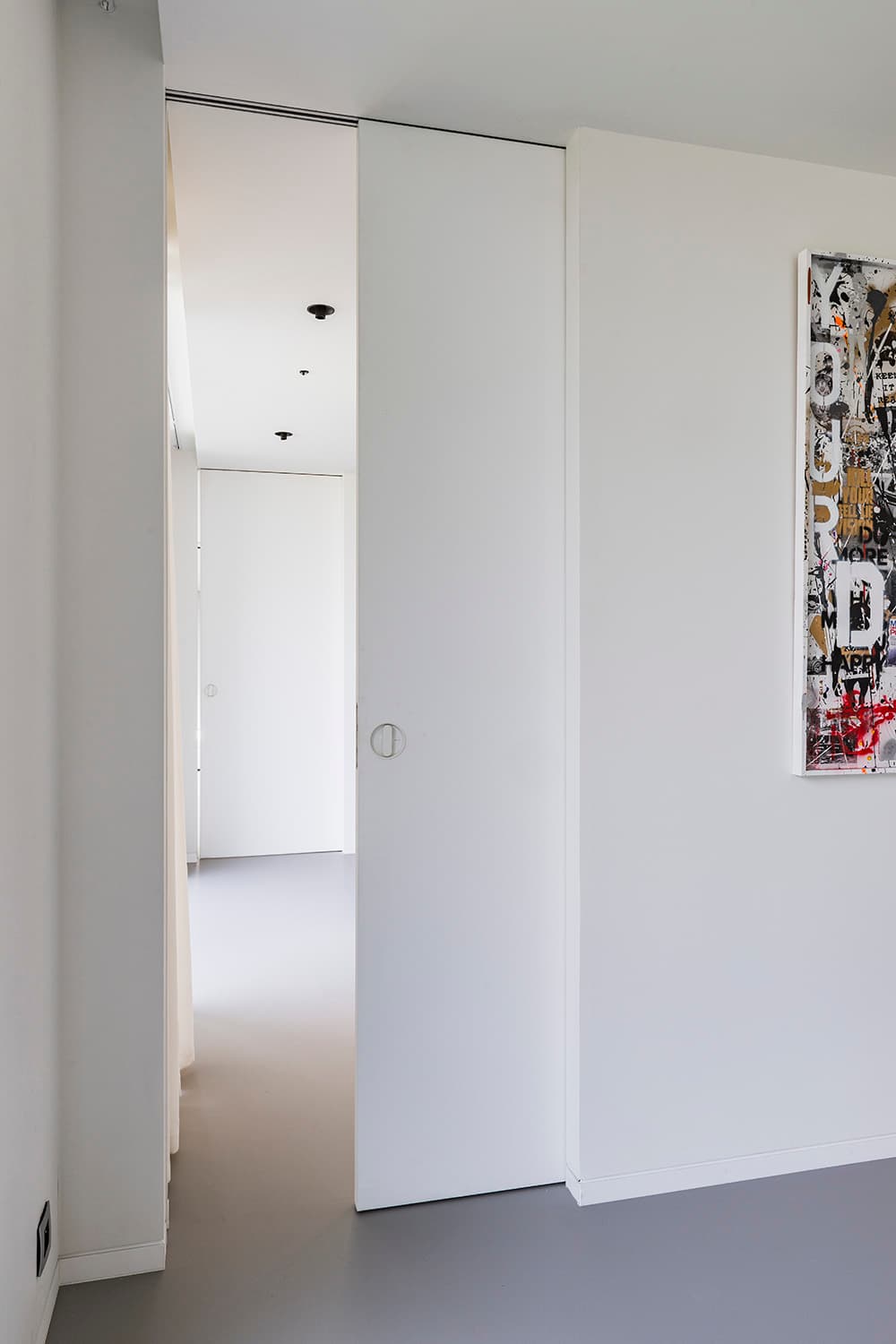 sliding pocket door in a minimalist interior