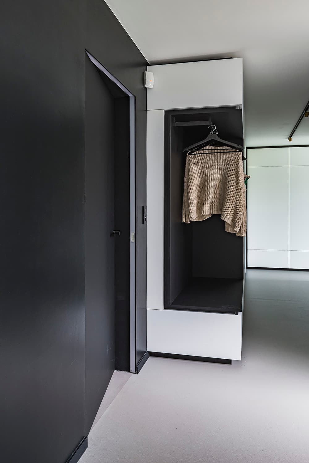 flush invisible door in a minimalist interior