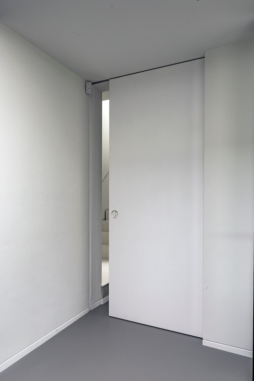 sliding pocket door in a minimalist interior