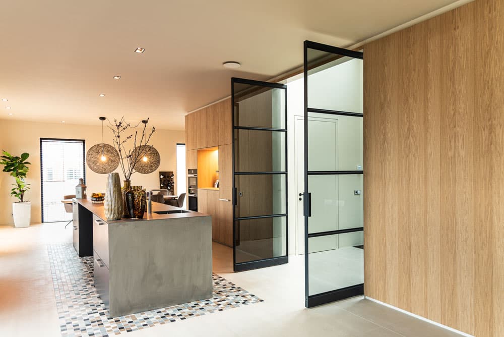 steel-glazed double pivot doors in black
