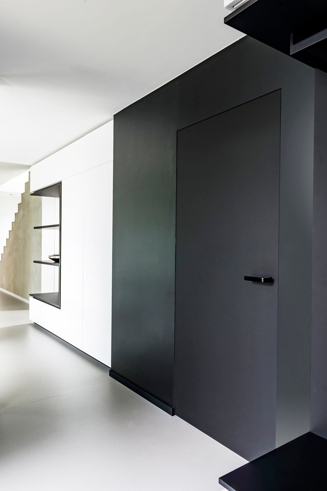 flush invisible door in a minimalist interior