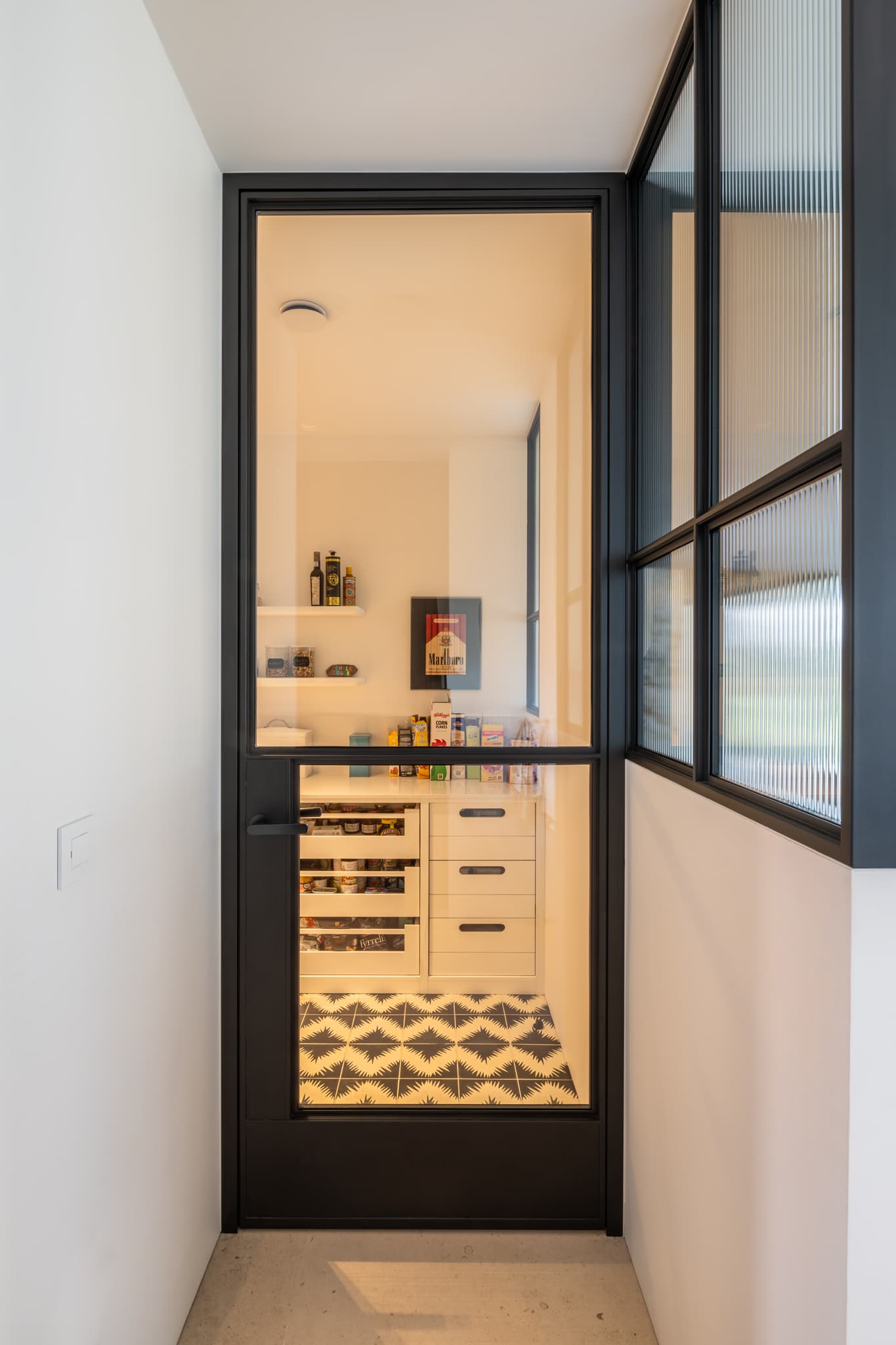 hinged sealed steel glazed internal door leading to a pantry and wine room