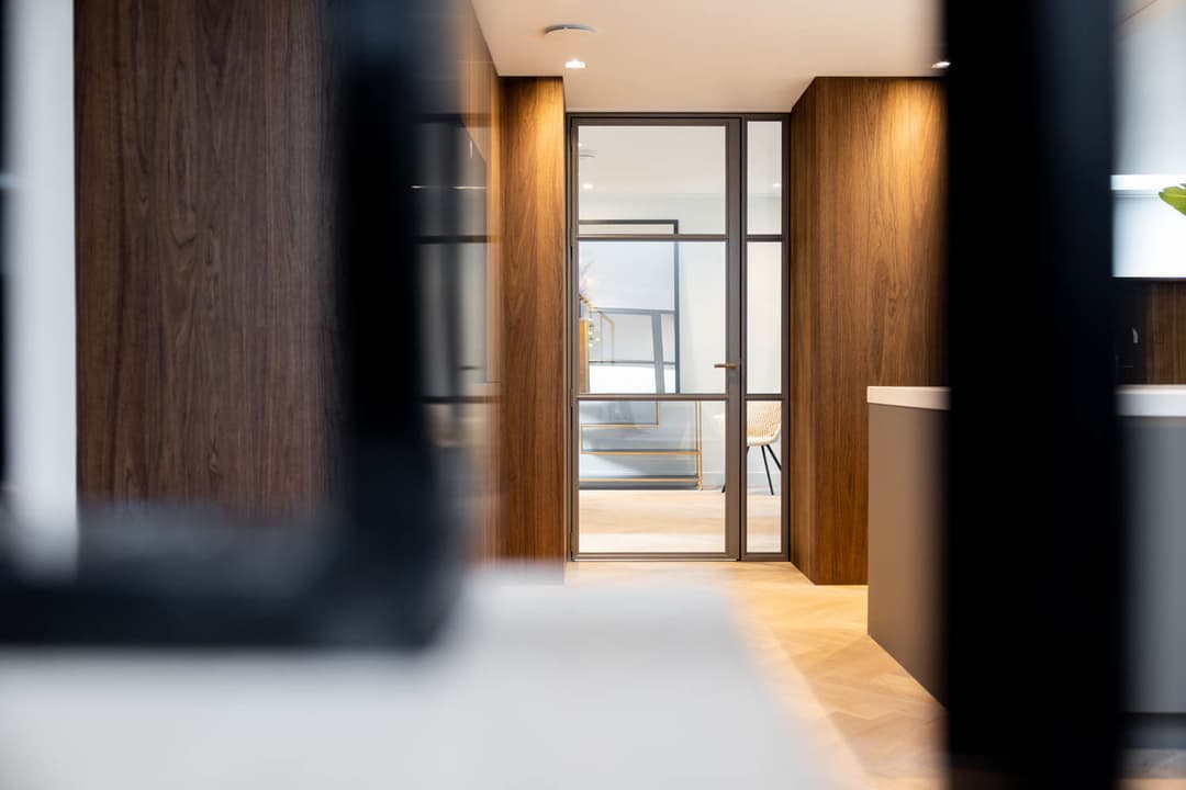 a hinged internal steel door in a bronze finish