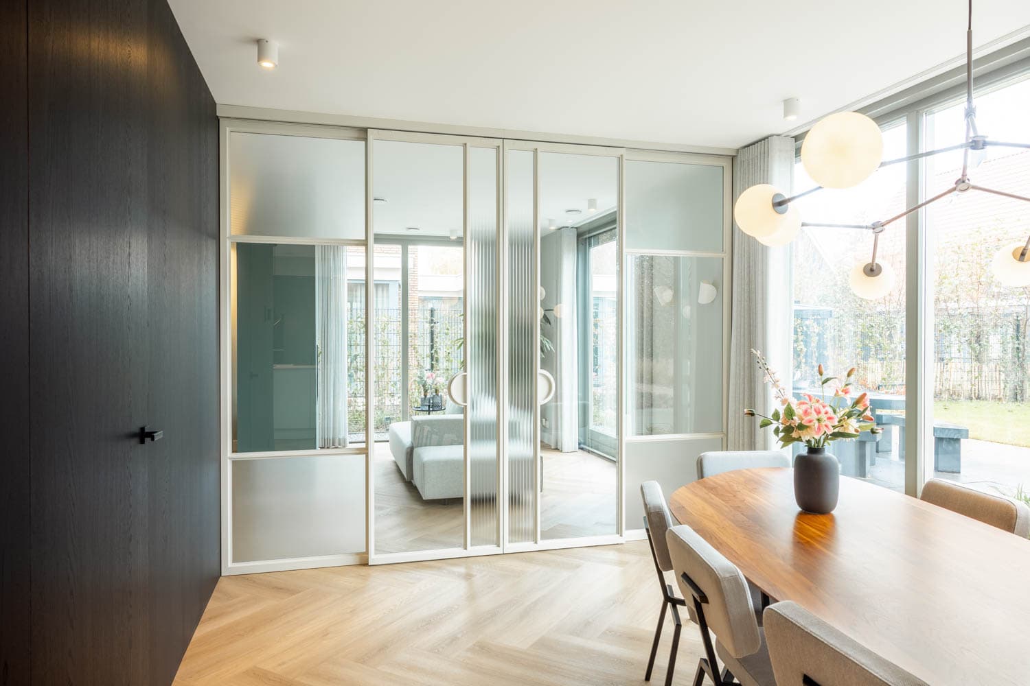 white steel glazed sliding doors used as a room divider in a high end private residence