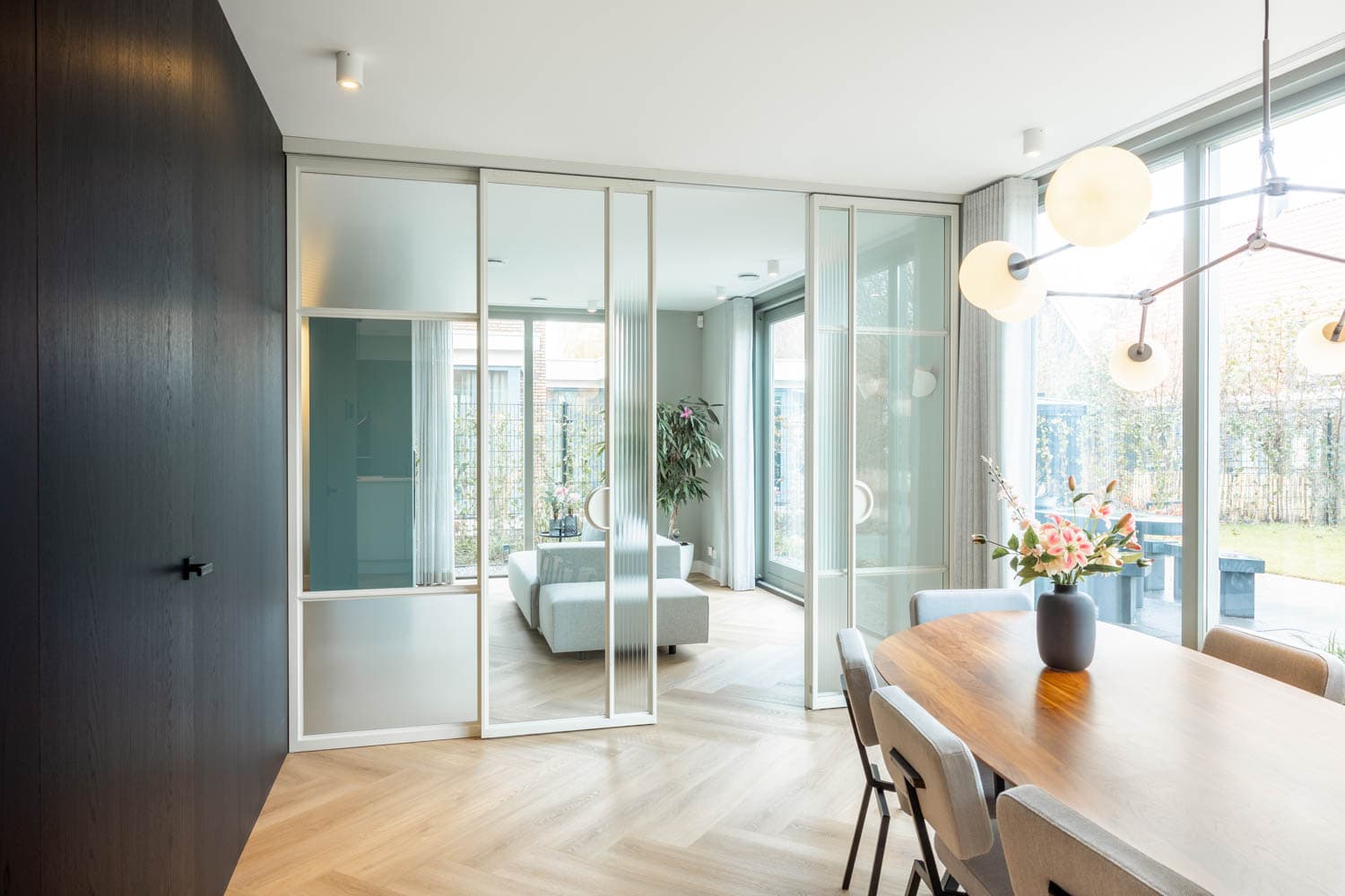 white steel glazed sliding doors used as a room divider in a high end private residence