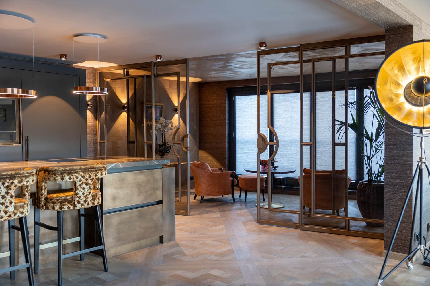 bronze finish sliding steel glazed doors forming a room divider