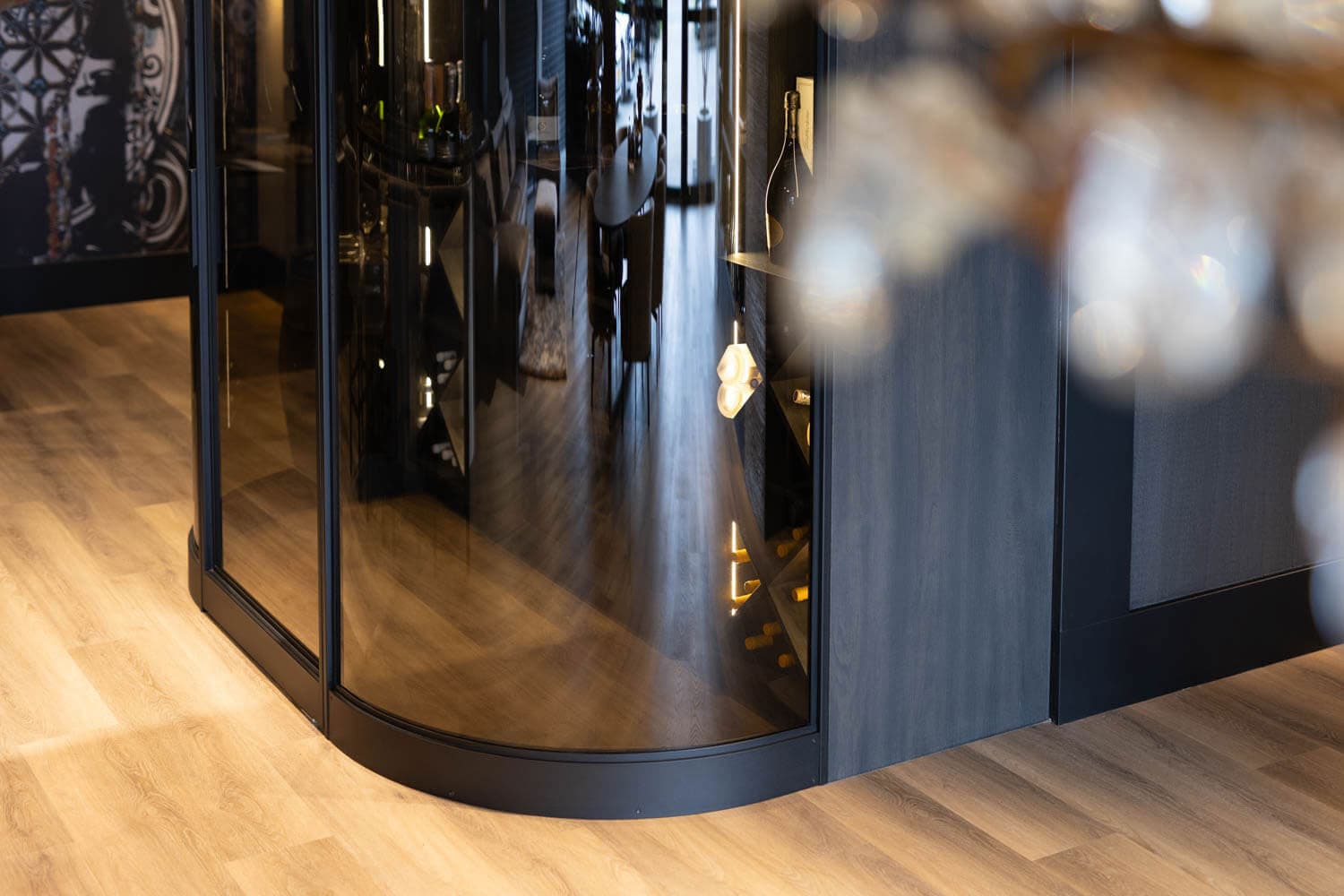 a curved steel screen used in a wine room