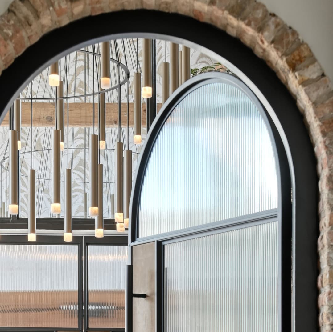arched steel door in a modern interior