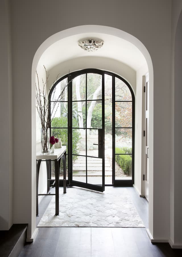 arched steel glazed door in entrance hall