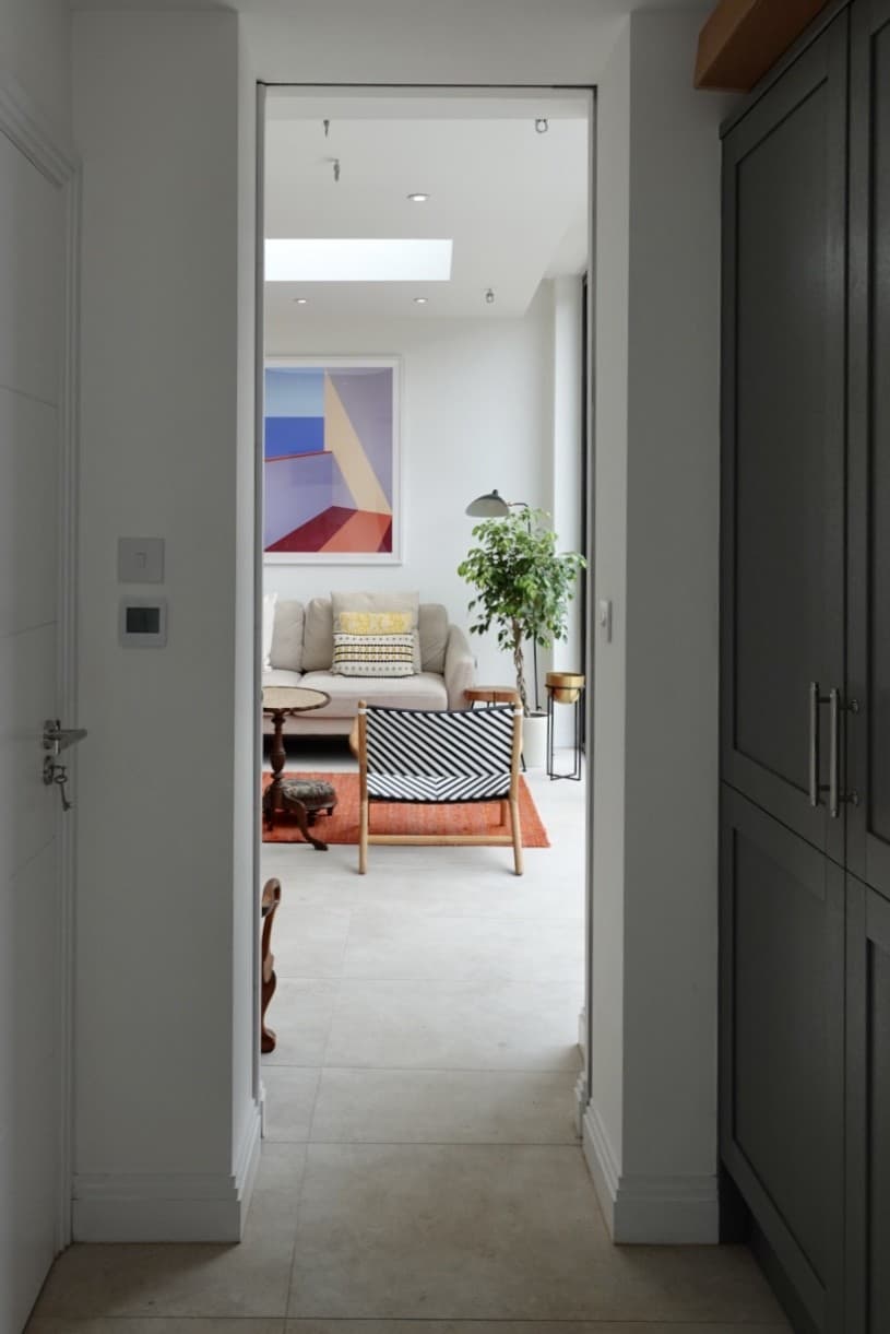 a sliding pocket door used to separate a garage and utility room from the family living space