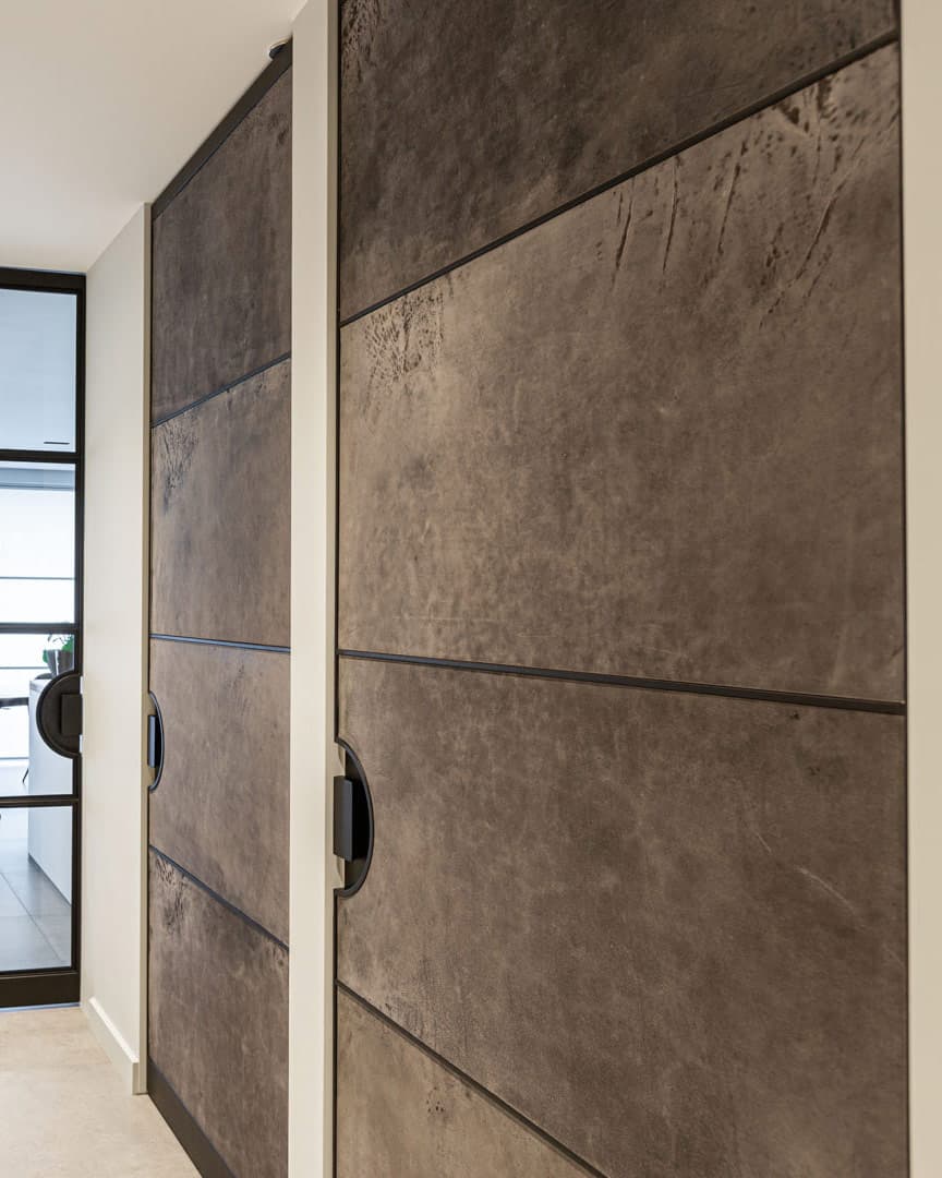 interior steel doors clad in neutral coloured leather