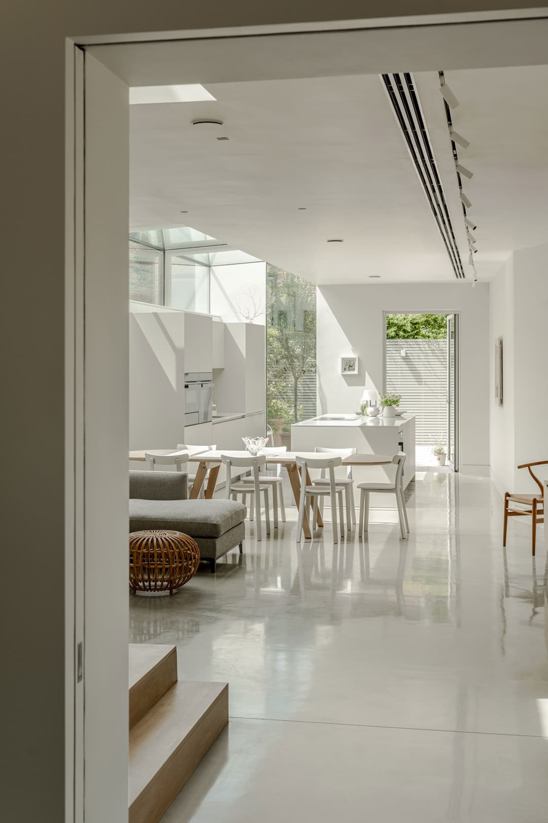 sliding pocket door in a minimalist interior by Or Studio