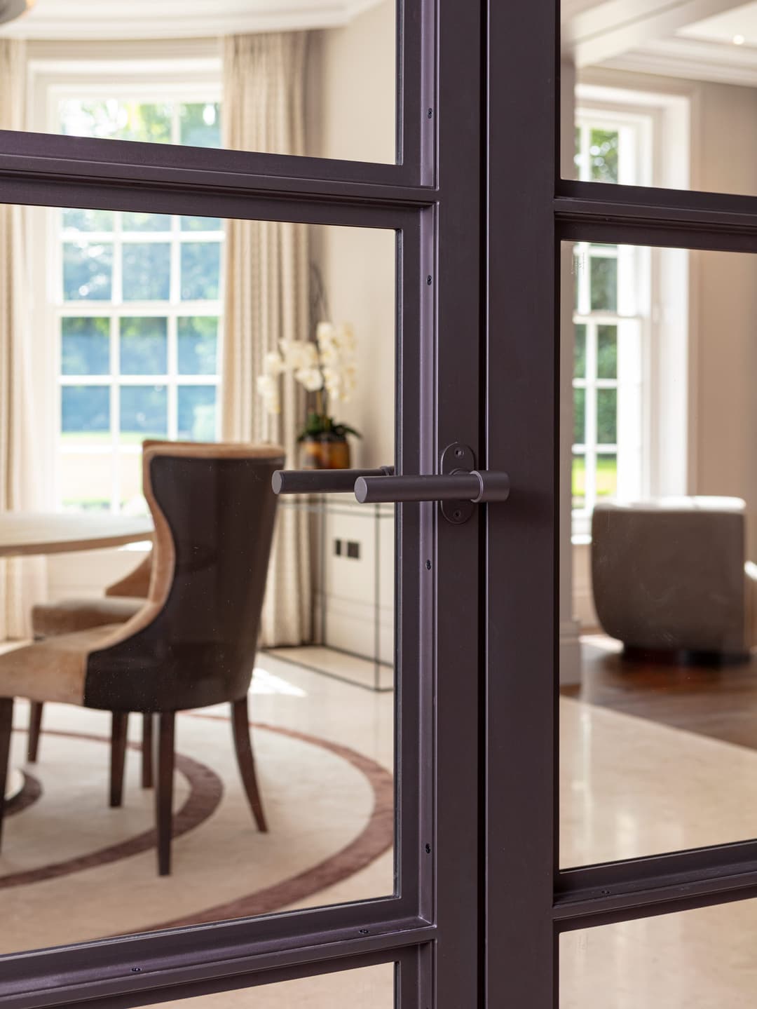 fire-rated double steel doors with lever handle in a high-end luxury interior