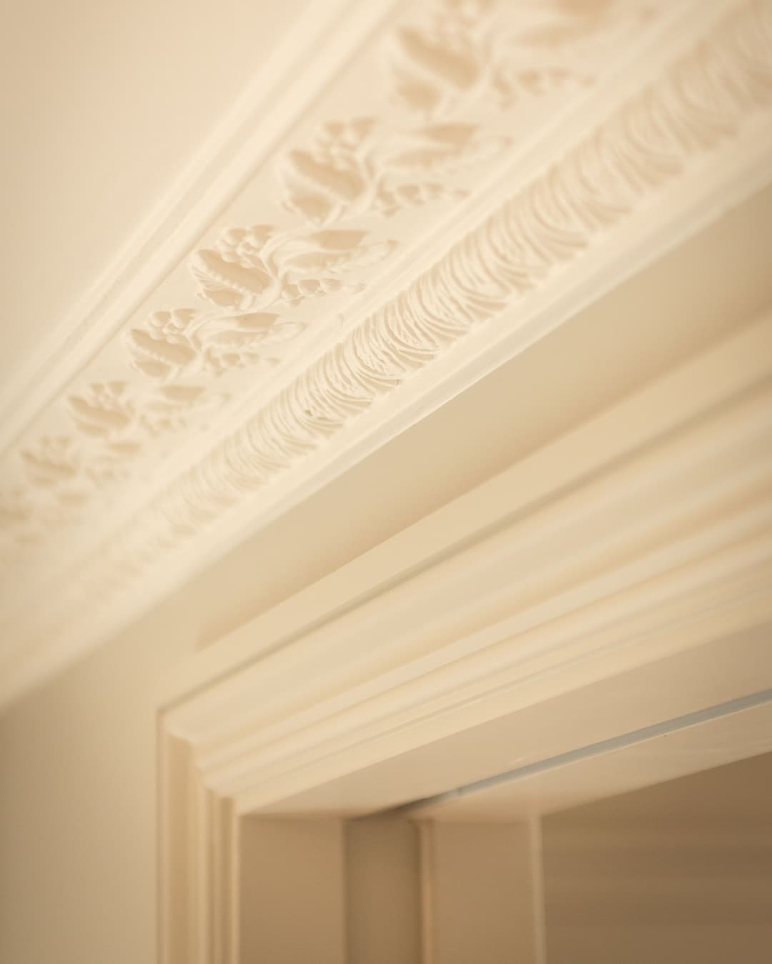 single sliding pocket door with minimal top rail by Envo in a high-end bedroom in Kensington, London